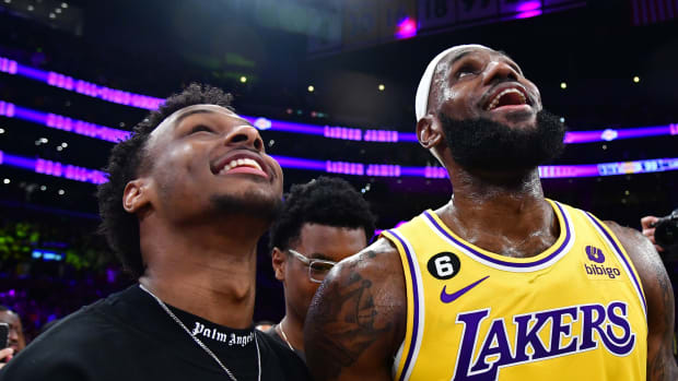 LeBron James celebrates with his son Bronny James after breaking the all-time scoring record.